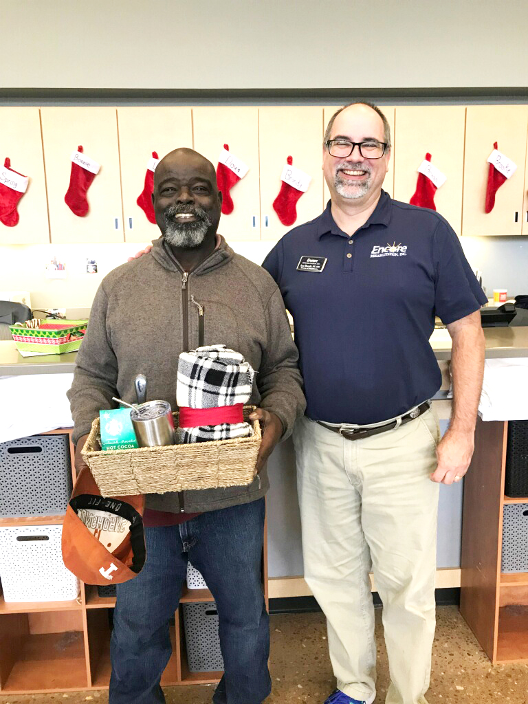 Berkley Smith is the December winner of our gift basket! He is shown here with Clinic Director Lee Borcik, PT, ATC. #EncoreRehab